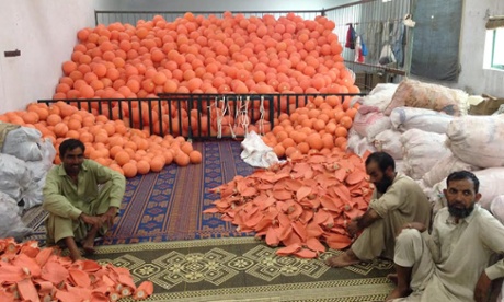 Workers at a ball-making factory in Pakistan
