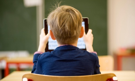 Little boy looking at an ipad