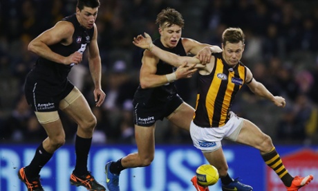 Sam Mitchell of the Hawks competes for the ball against Patrick Cripps