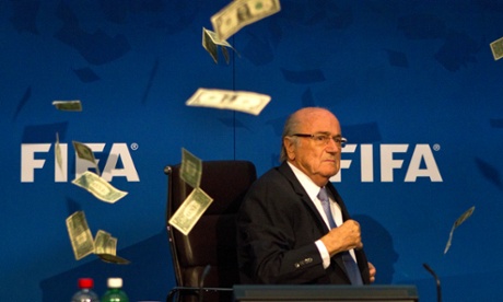 Sepp Blatter looks visibly unsettled by the money raining down on him.