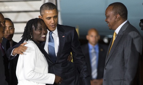 Kenyan president Uhuru Kenyatta, right, watches as Barack Obama, center, hugs his half-sister Auma Obama, after arriving at Kenyatta International Airport on Friday.