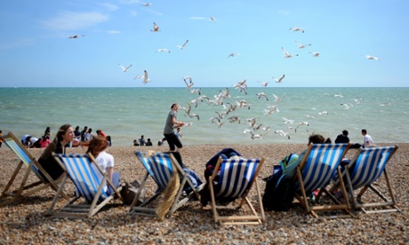 Under attack: tourists on the seafront at Hove.