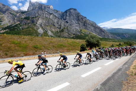 Team Sky rider Christopher Froome with his team-mates and the peloton.