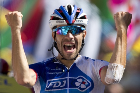 Thibaut Pinot of France celebrates as he crosses the finish line to win the twentieth stage.
