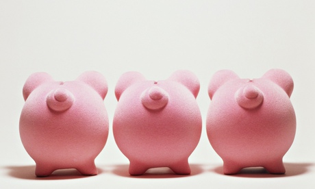 Three pink piggy banks in a row