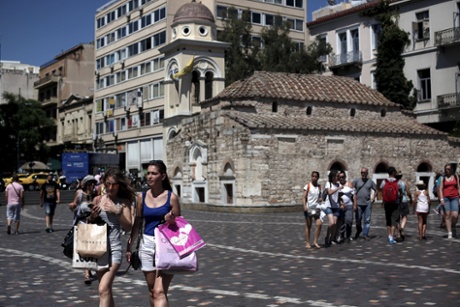 People make their way on Monastiraki square in central Athens, Greece July 19, 2015