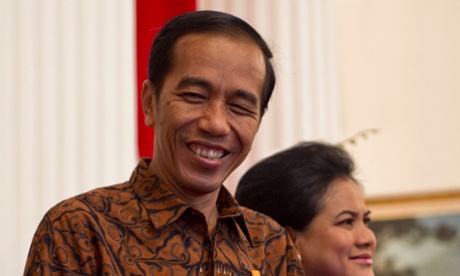 Indonesia's President Joko Widodo accompanied by First Lady Iriana Widodo 