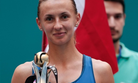 Lesia Tsurenko of Ukraine celebrates with the trophy after defeating Urszula Radwanska of Poland in the final of the Istanbul Cup in Turkey.