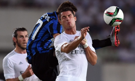 Real Madrid forward Cristiano Ronaldo challenges for the ball against Internazionale.