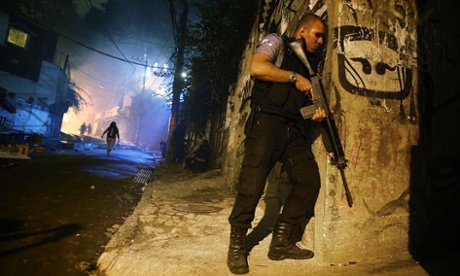 Brazilian police patrolling a street at night in Rio de Janeiro, Brazil.