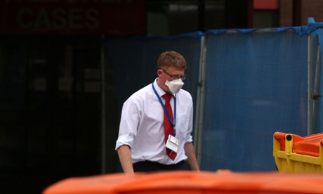 A man walks out of Manchester Royal infirmary A&E with a face mask on as the unit is closed amid Mers fears.