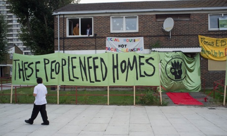 Banners outside the occupied Carpenters estate flats in Newham where Focus E15 highlight the lack of affordable housing in London despite empty homes being available.