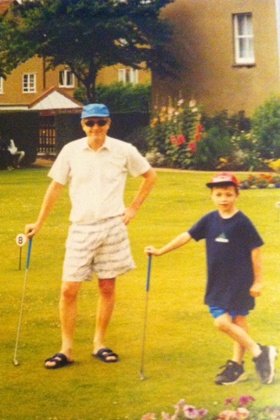 Ben Norris on the putting green with his father, Ray.