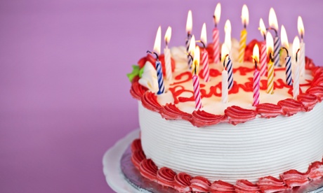 A birthday cake with lit candles