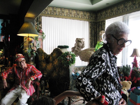 Carl Apfel, left, and Iris Apfel, right, at their home. Kermit and the ostrich are just seen in the background.