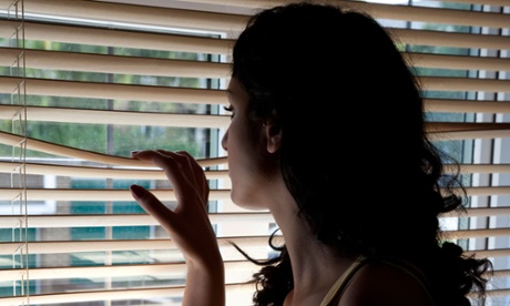 Woman looking out of a window