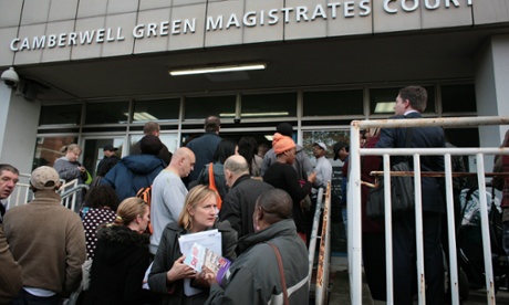 People issued with summons for council tax arrears by Southwark council wait outside Camberwell Magistrates court in October 2013.