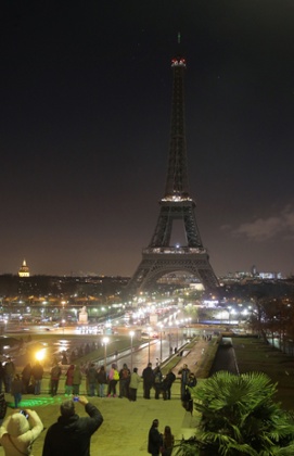 The Eiffel tower's lights are switched off, the day after the Charlie Hebdo attacks.