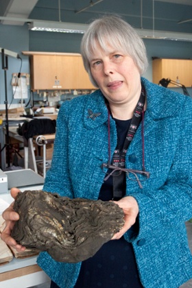 London met arch principal archivist Phillipa Smith holding a City of London freedom register from the 17th and 18th centuries destroyed beyond repair in the fire of 1786.