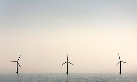 An off-shore wind farm stands in the water near the Danish island of Samso