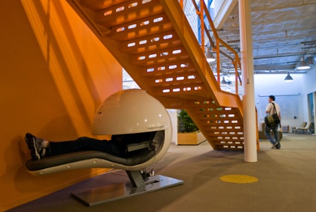 An employee snoozes in the nap pod at Google HQ. Apple, Nike and the Huffington Post have also introduced napping infrastructure into their offices.