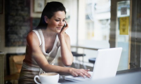 woman in coffee shop with laptop