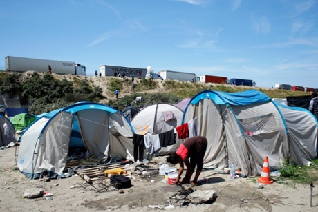 A migrant at a makeshift camp at Calais.