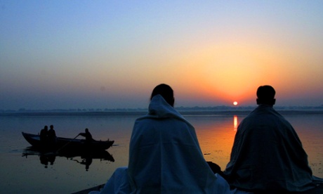 people meditating by river ganges