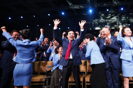 The Beijing delegation celebrates.