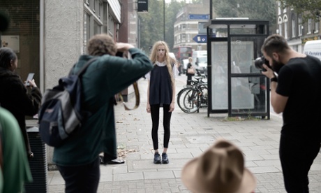 Street-style photographers snap a model