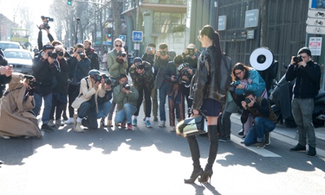 Model Ming Xi with street-style photographers during Paris Collections: Women on March, 2014
