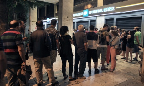 People queuing to withdraw money from an ATM  in Athens earlier this week.