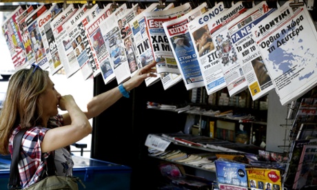 The newspaper on the right showing a map of Greece reads 