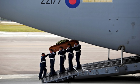 The coffin of Christopher Bell is carried from an RAF aircraft