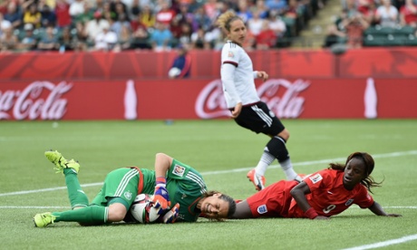 Nadine Angerer snuffs out the threat posed by Eniola Aluko.
