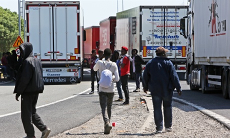Lorries and migrants in Calais