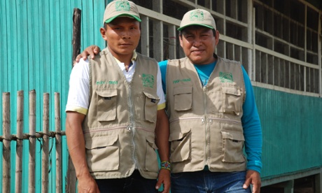 Ashéninka man Enoc Ruiz Santos and Shipibo man Pedro Monteluisa Romaina at a control post protecting a reserve for indigenous peoples living in 