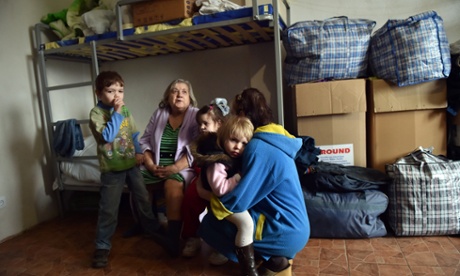 Refugees from the Donetsk region, which is controlled by pro-Russia separatists, gather at a centre in the eastern Ukrainian city of Slavyansk, which is controlled by Ukrainian forces