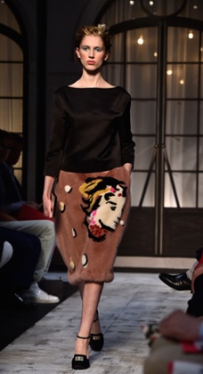 A model in a skirt emblazoned with Elsa’s face on the Schiaparelli catwalk