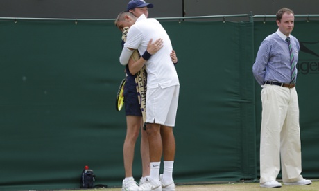 Nick Kyrgios hugs a ballboy during his incident-packed match against Richard Gasquet.