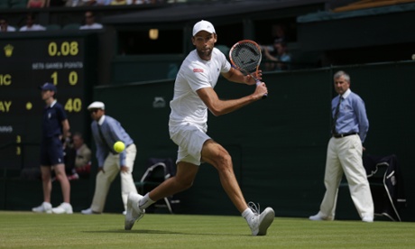 Ivo Karlovic sizes up a return in the first set, which is all square.