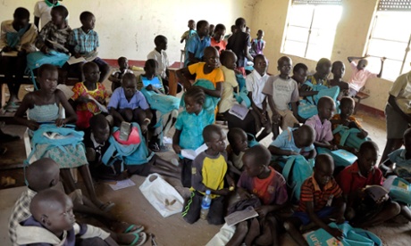Children sit inside a looted classroom at the Doronj Sown secondary school after renewed conflict in Bor, Jonglei state 