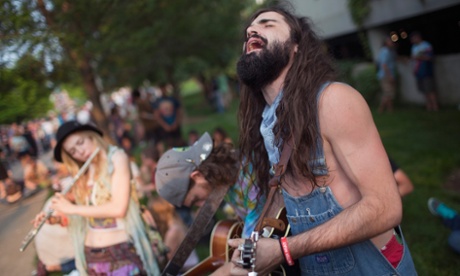 Hope Dean (l), Harry Cooper and Dylan Kader play for Grateful Dead fans as they wait for the gates of Soldier Field to open.