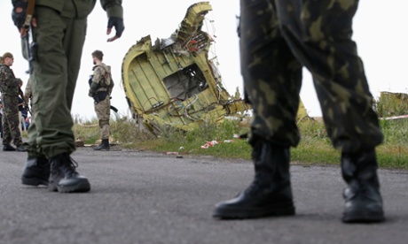 Pro-Russia separatists stand guard at crash site