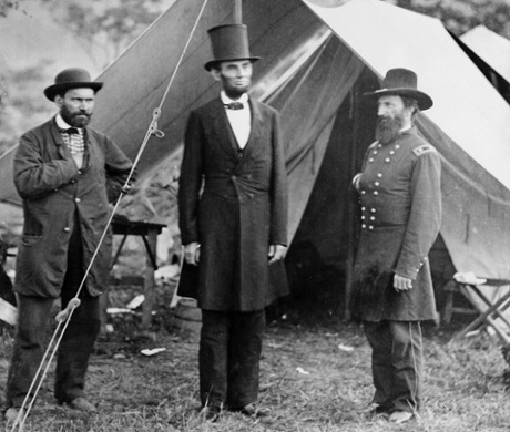 President Abraham Lincoln (C) with Major Allan Pinkerton (L) of the Pinkerton National Detective Agency and General John A McClernand, visiting camp at Sharpsburg, 1862.