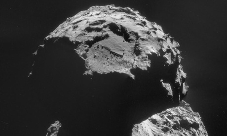 Comet 67P looms in the darkness.