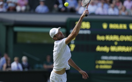 Ivo Karlovic attempts a volley at the net.