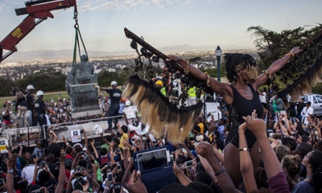 Students cheer as the Cecil Rhodes statue is being removed from the University of Cape Town on April 9, 2015 in Cape Town, South Africa.