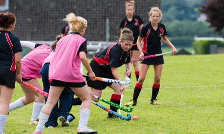 Girls playing hockey