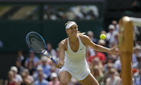 Sharapova dinks the ball over the net.